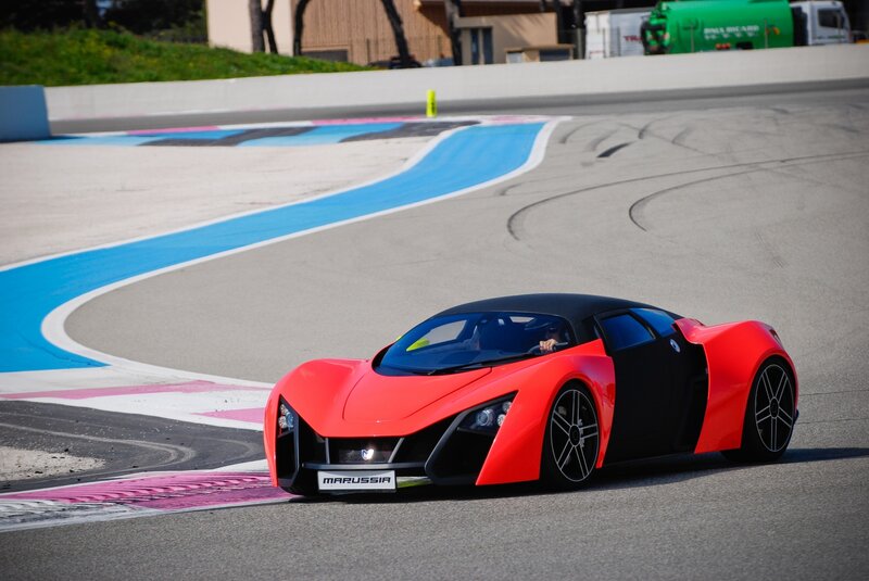 Red sports car on racetrack