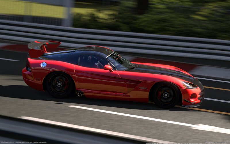 red sports car on racetrack