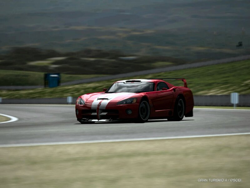 red sports car on racetrack