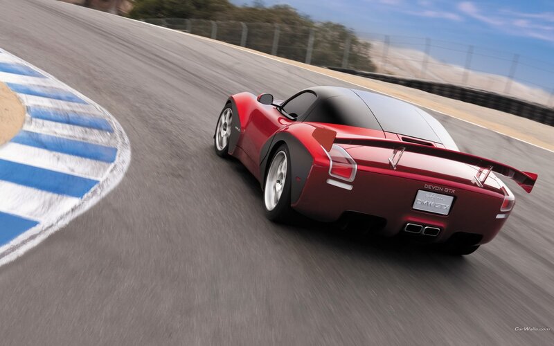 Red sports car on racetrack