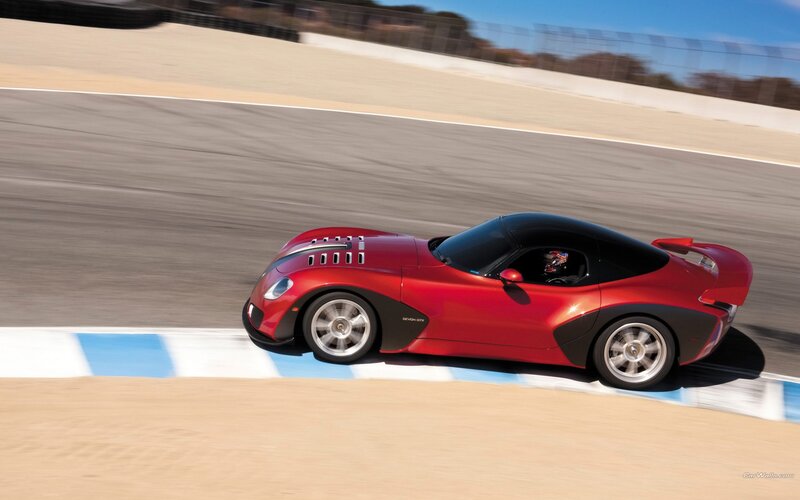 Red sports car on racetrack