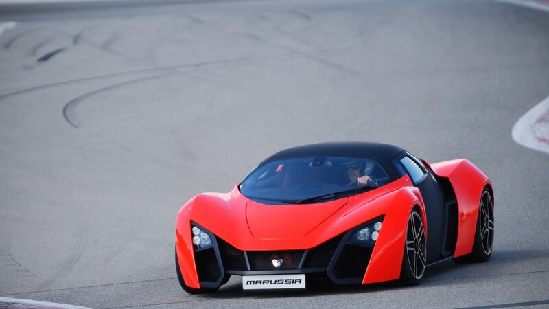 Red sports car on racetrack