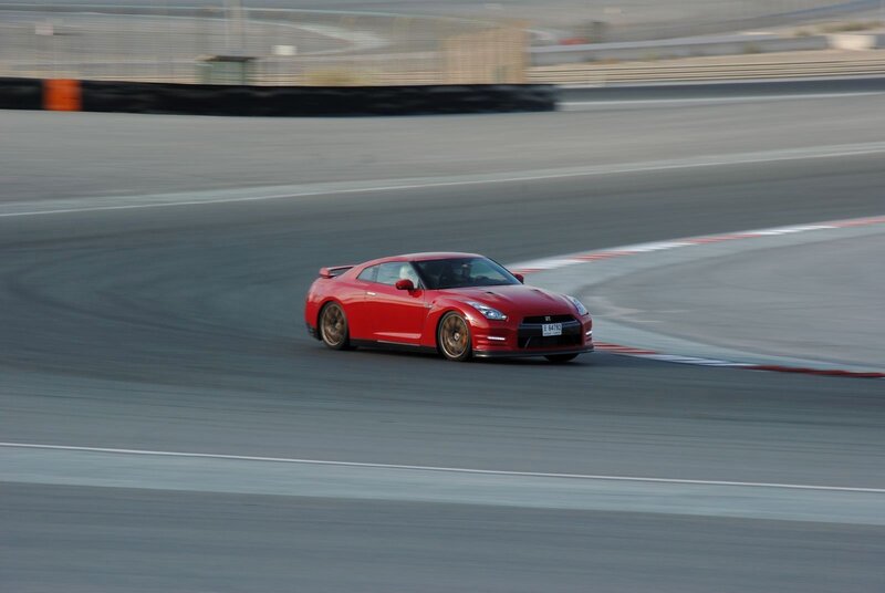 Red sports car on racetrack