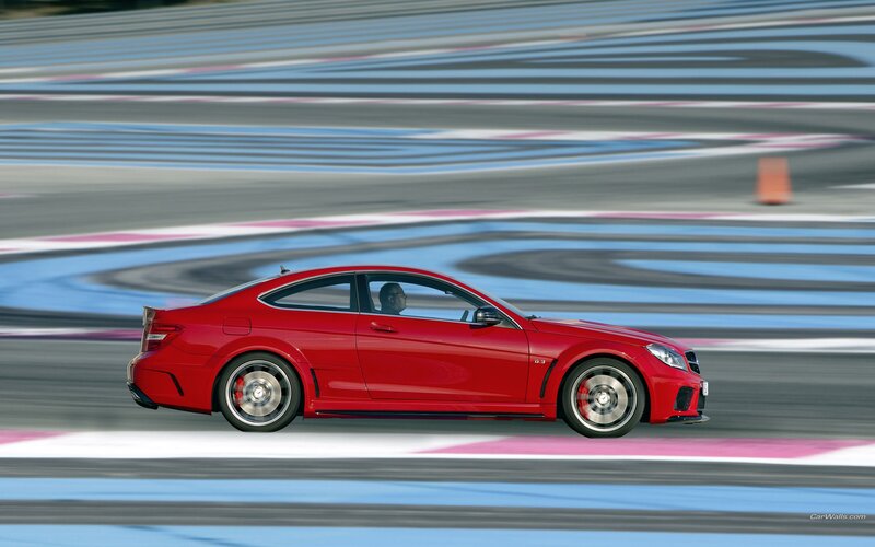 Red sports car on racetrack