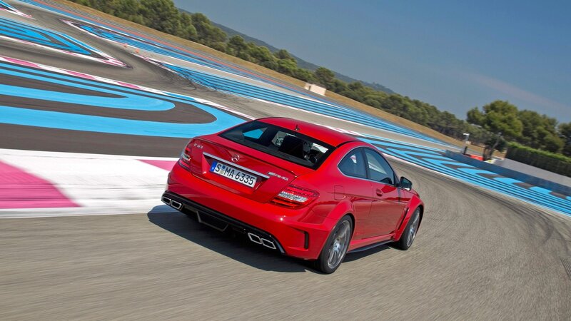 Red sports car on racetrack