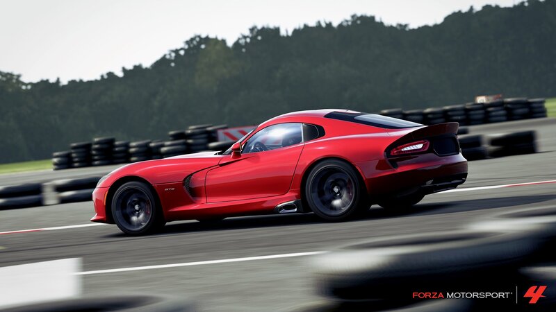 Red sports car on racetrack