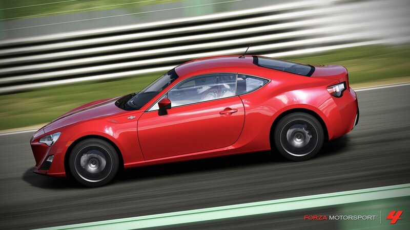 red sports car on racetrack