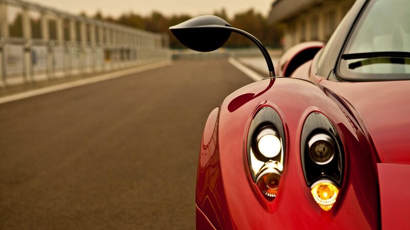 red sports car on racetrack
