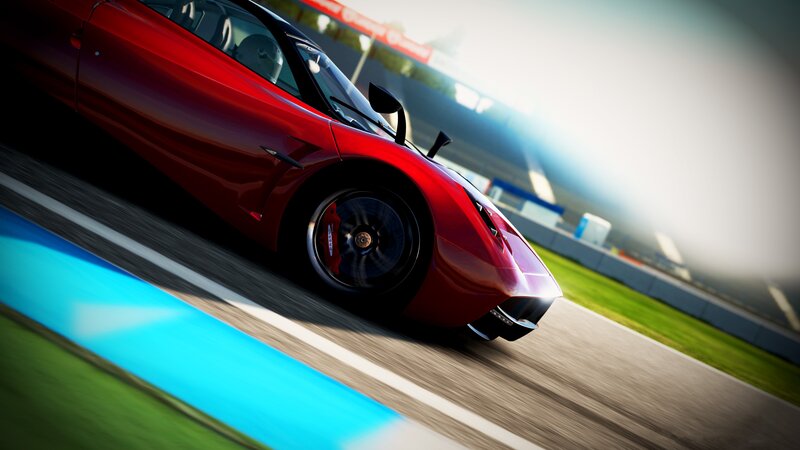 Red sports car on racetrack