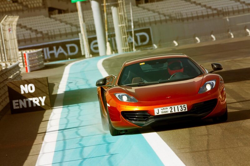 Red sports car on racetrack