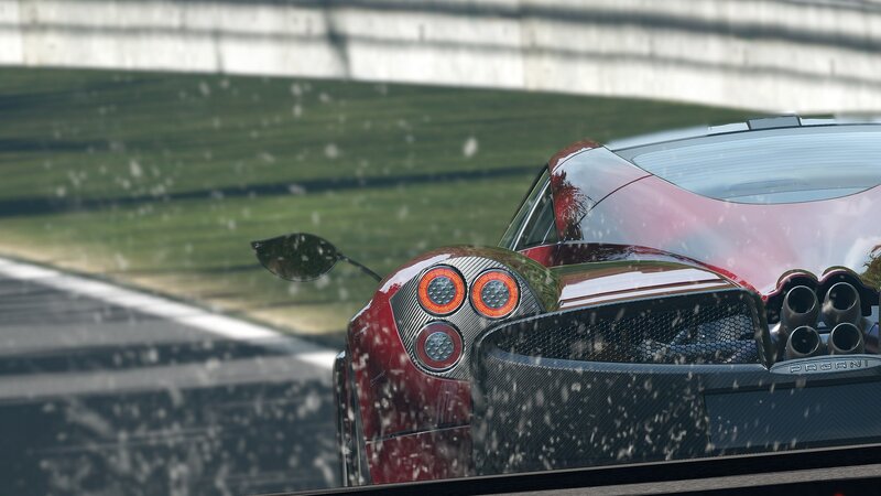 red sports car on racetrack