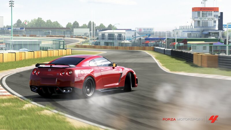 Red sports car on racetrack