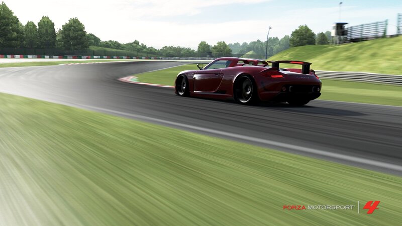 red sports car on racetrack