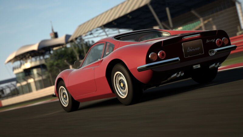 red sports car on racetrack