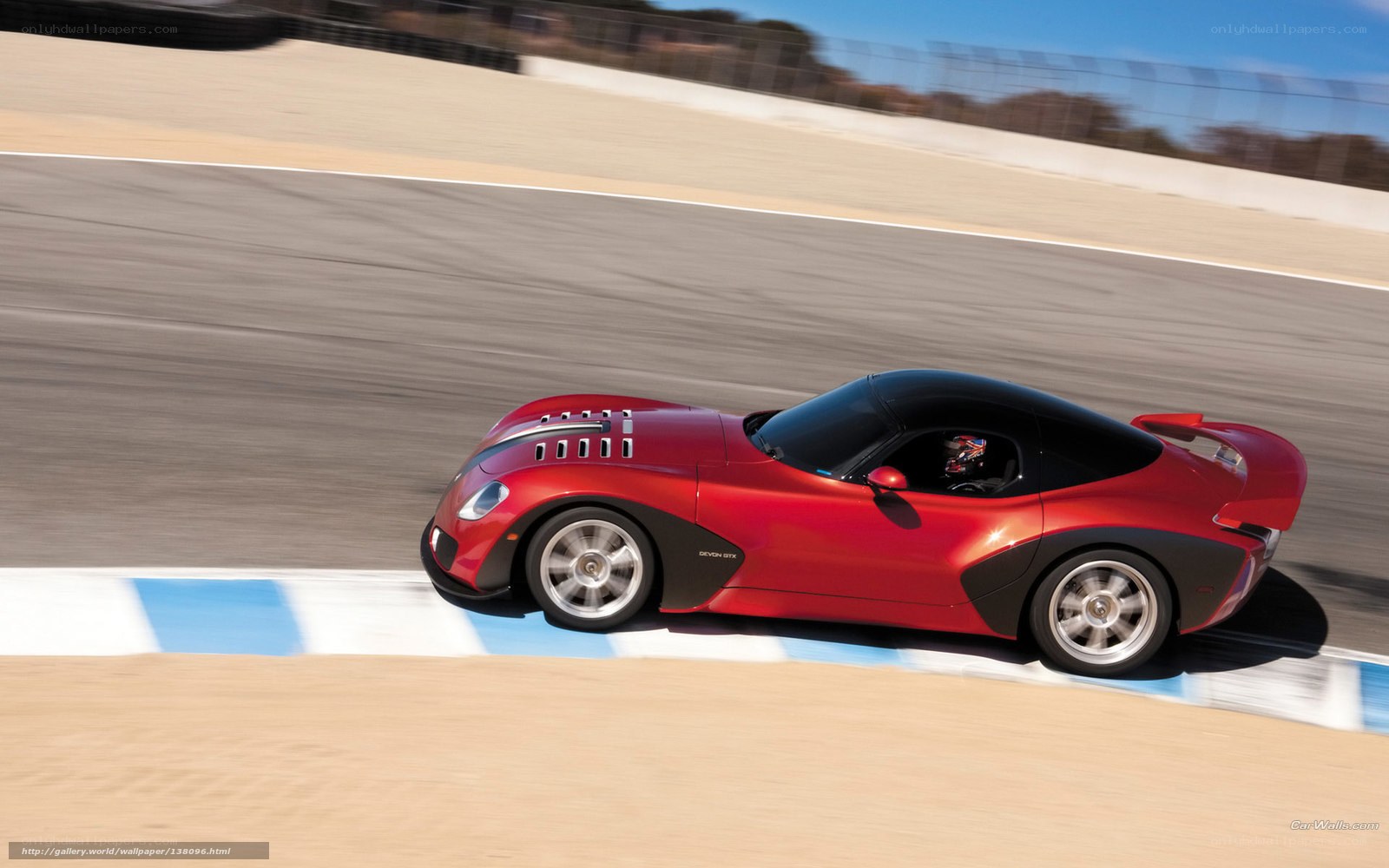 Red sports car on racetrack