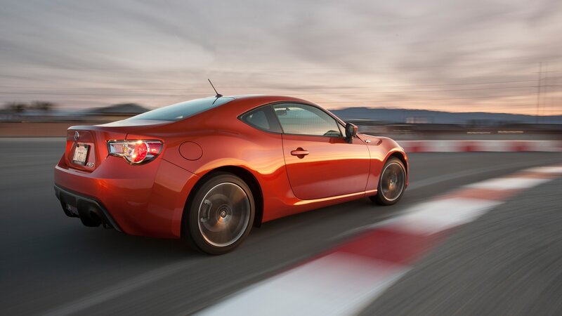 red sports car on racetrack
