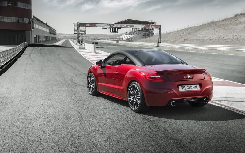 Red sports car on racetrack