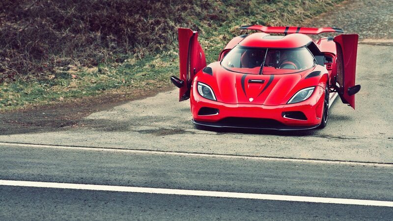 red sports car on road