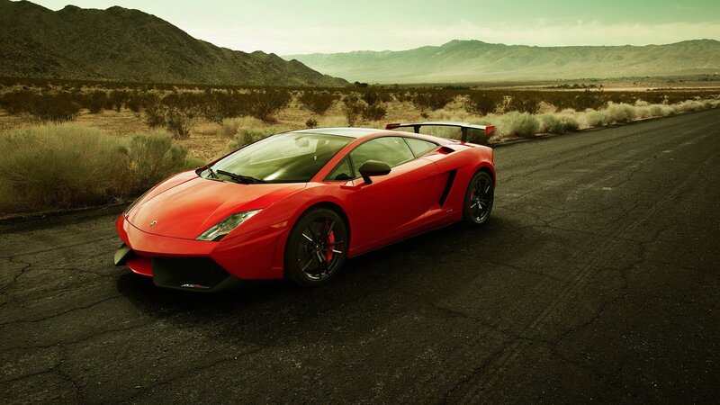 Red Sports Car on Road — Dramatic, Afternoon, Photograph, Mountains