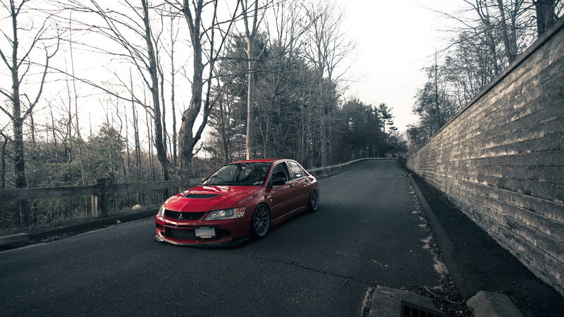 Red Sports Car on Road — Dramatic, Winter, Photograph
