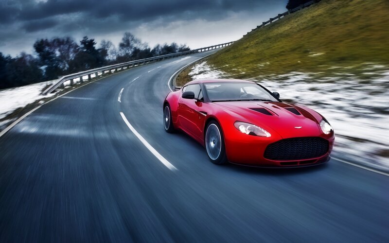 Red Sports Car on Road — Dramatic, Winter
