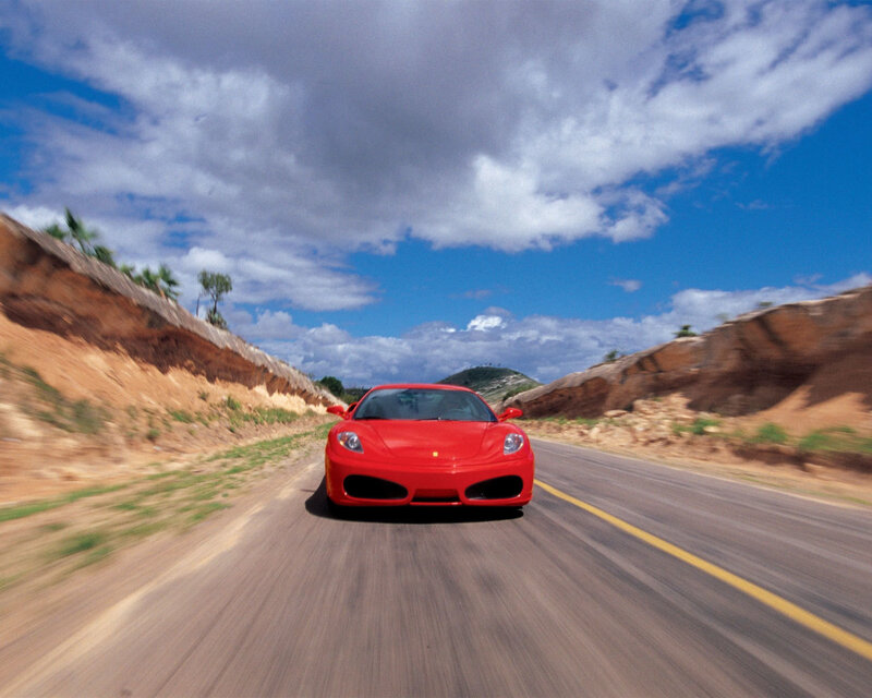Red Sports Car on Road — Dynamic, Afternoon, Photograph, Clouds, Hills