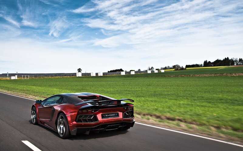 Red Sports Car on Road — Dynamic, Afternoon, Photograph, Field, Sky, Green