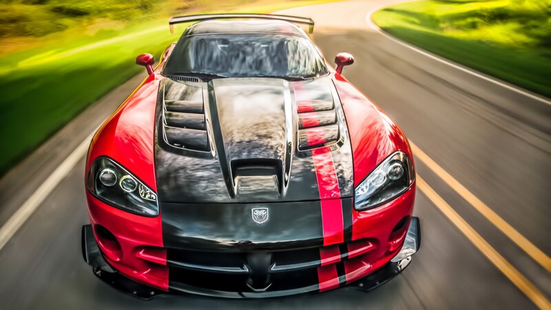 Red Sports Car on Road — Dynamic, Afternoon, Photograph, Grass
