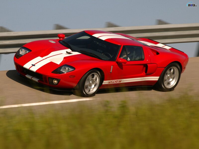 Red Sports Car on Road — Dynamic, Afternoon, Photograph, Guardrail