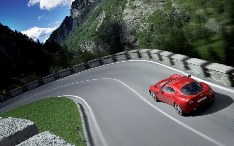Red Sports Car on Road — Dynamic, Afternoon, Photograph, Mountain, Trees, Green, Gray, Ar 008 Eu