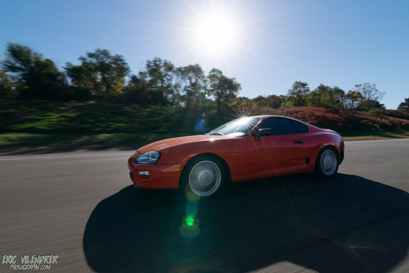 Red Sports Car on Road — Dynamic, Afternoon, Photograph, Sun
