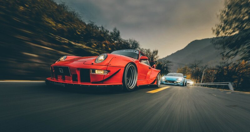 Red Sports Car on Road — Dynamic, Sunset, Photograph, Cars
