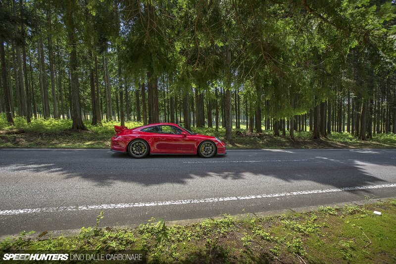 Red Sports Car on Road — Serene, Afternoon, Photograph, Forest
