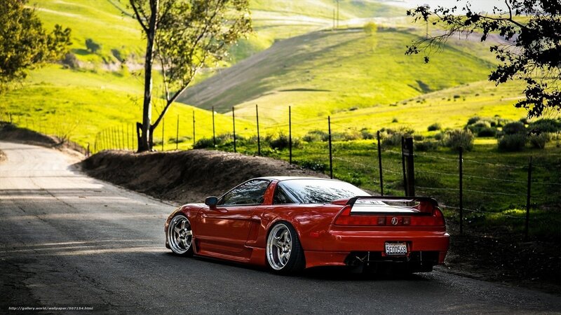 Red Sports Car on Road — Serene, Afternoon, Photograph, Hills, Fence, Green
