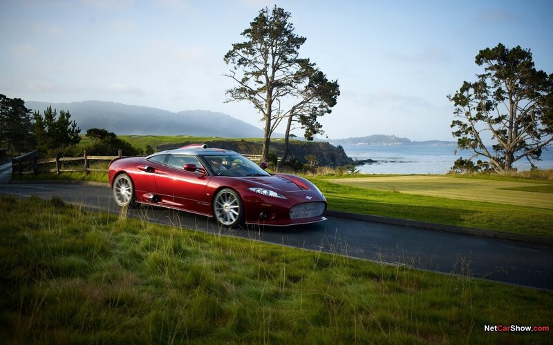 Red Sports Car on Road — Serene, Afternoon, Photograph, Tree, Golf Course