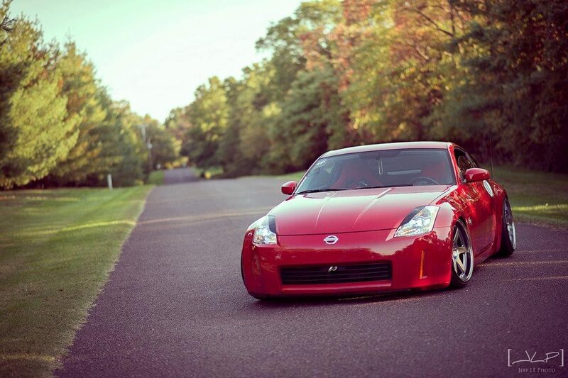 Red Sports Car on Road — Serene, Autumn, Photograph, Trees, Grass