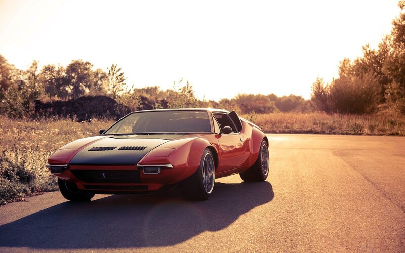 Red Sports Car on Road — Serene, Sunset, Photograph, Trees