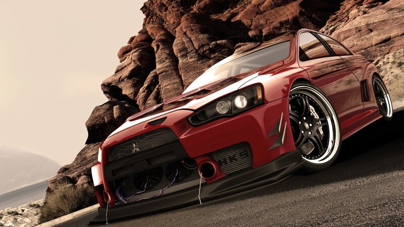 red sports car on rocky road
