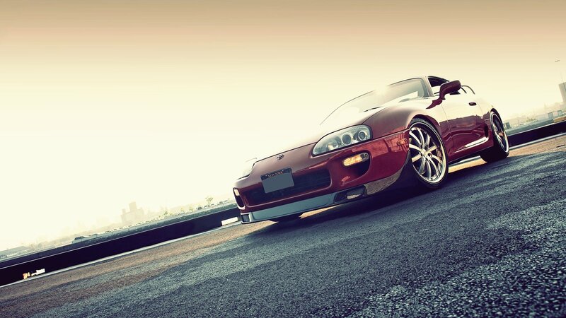 Red sports car on rooftop