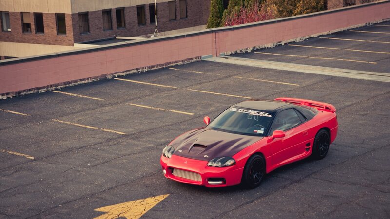 Red sports car on rooftop