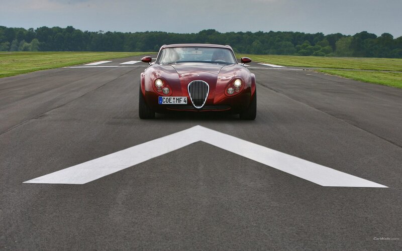 Red sports car on runway