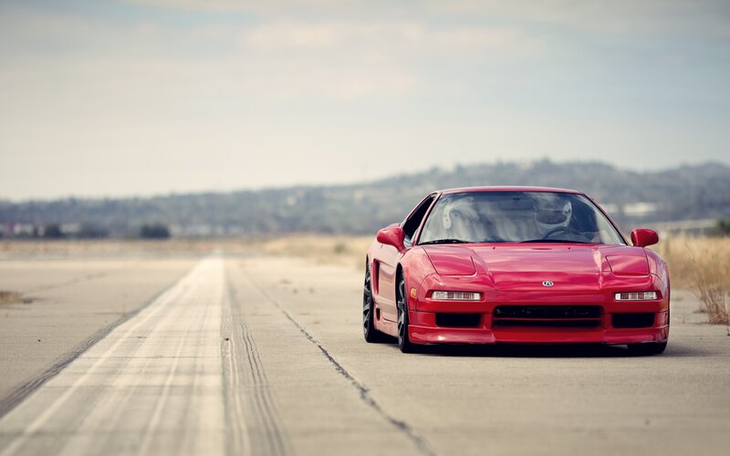 Red sports car on runway