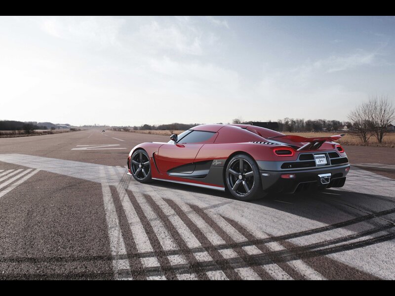 Red Sports Car on Runway — Dramatic, Afternoon, Photograph, Tire Marks