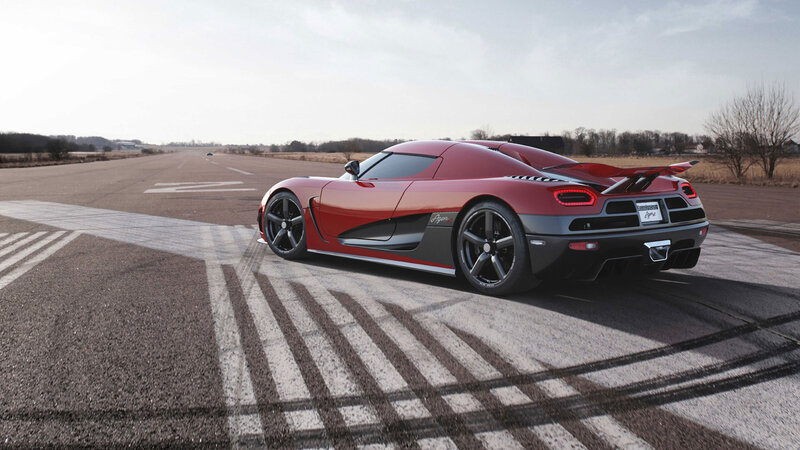 Red Sports Car on Runway — Dramatic