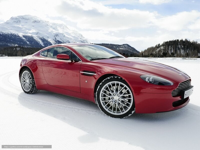 Red sports car on snowy landscape
