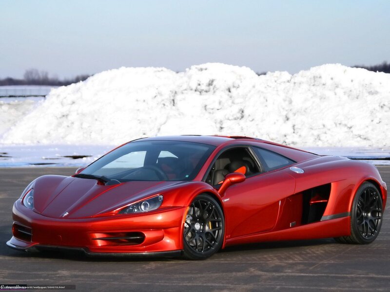 Red sports car on snowy lot