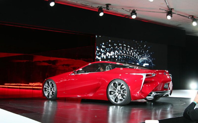 Red Sports Car on Stage — Dramatic