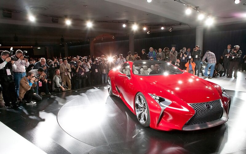 Red Sports Car on Stage