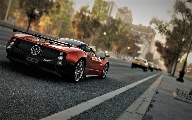 Red Sports Car on Street — Dynamic, Sunset