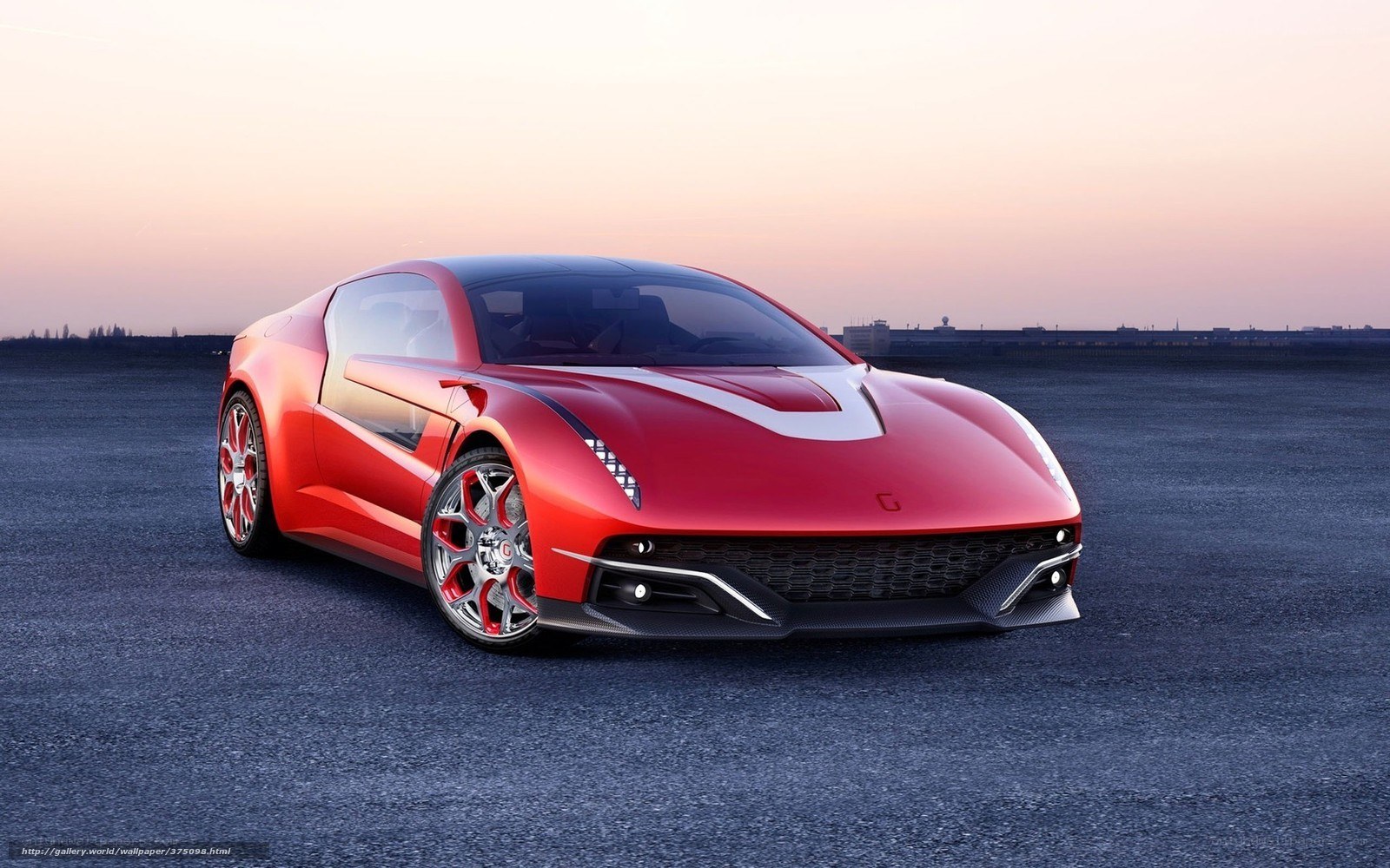 Red sports car on tarmac